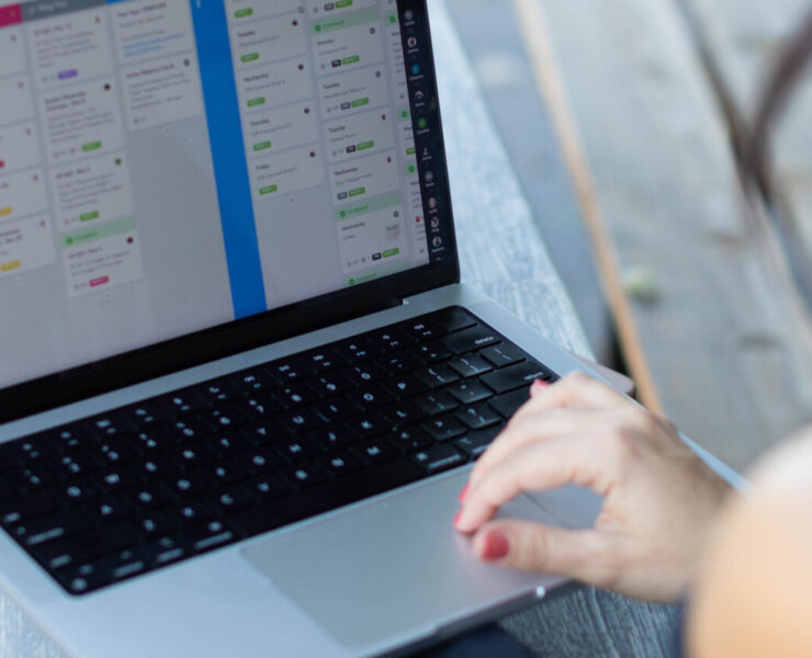 a woman behind a computer screen