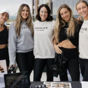 women in Pvolve clothing smile for a group photo