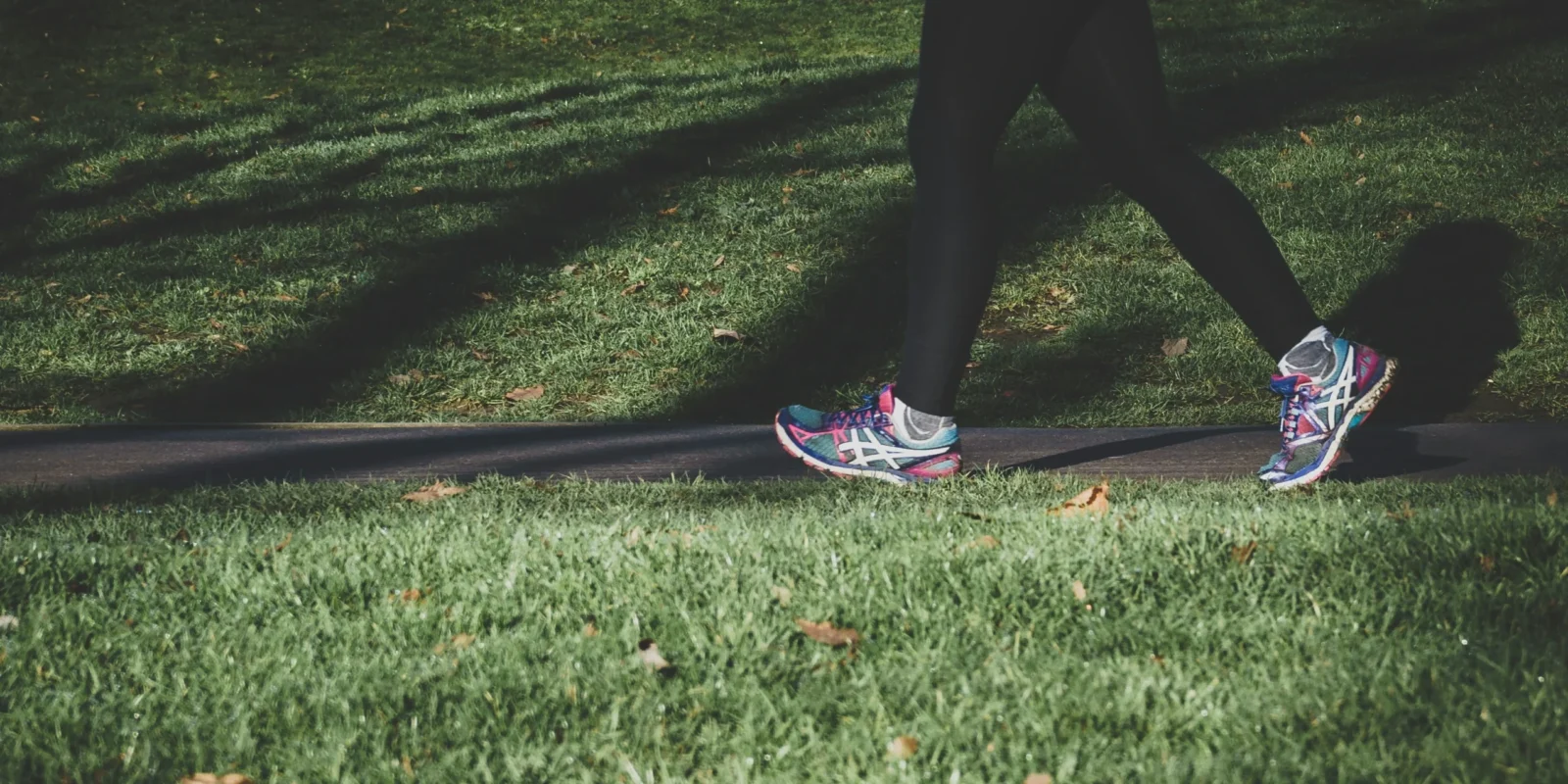 person walking on grass