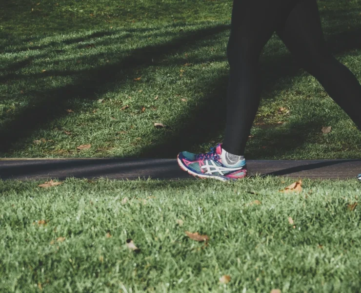 person walking on grass