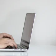 a person typing on a laptop