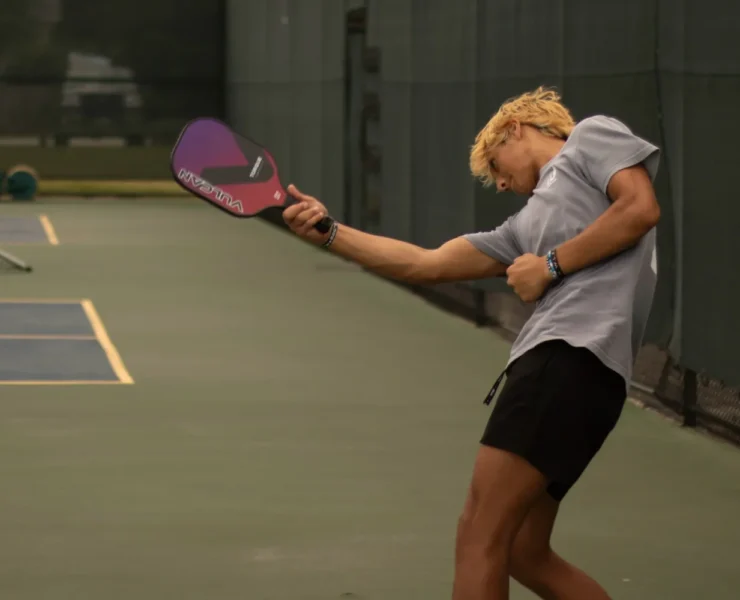 a man playing pickleball
