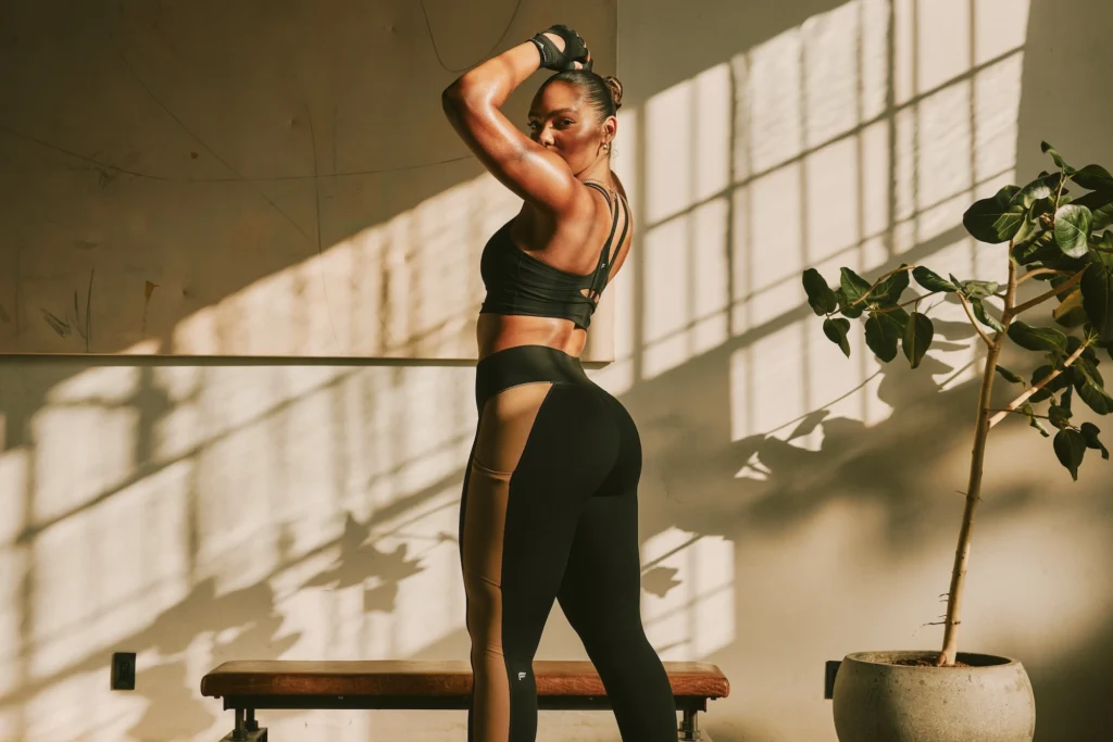 woman wears a black activewear suit