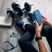 woman looks at a fitness app before working out
