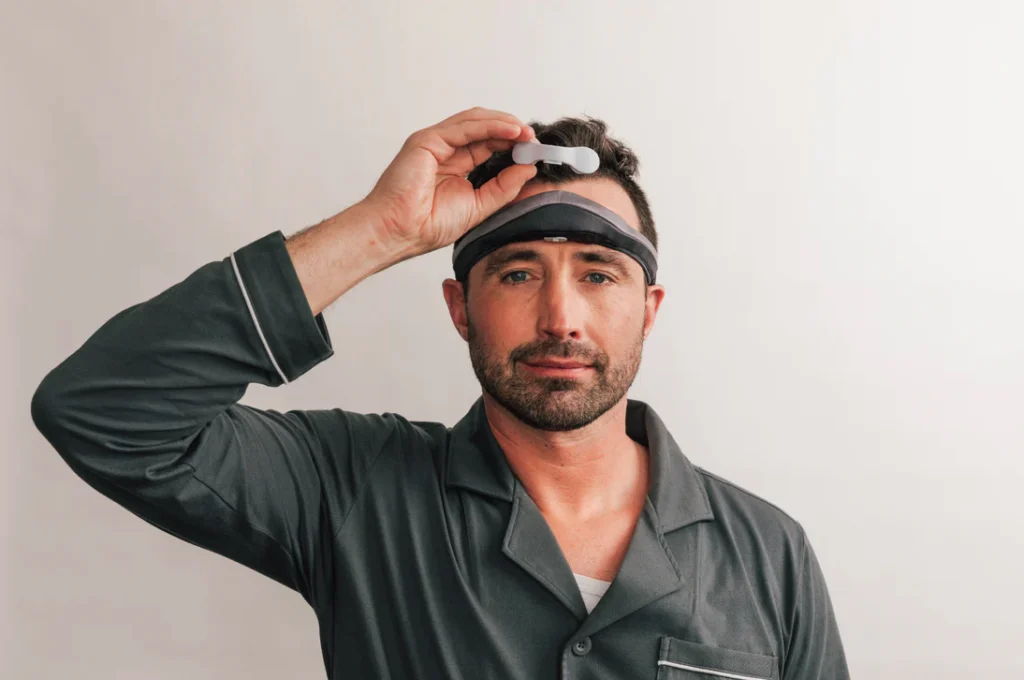 man wears a somnee sleep headband